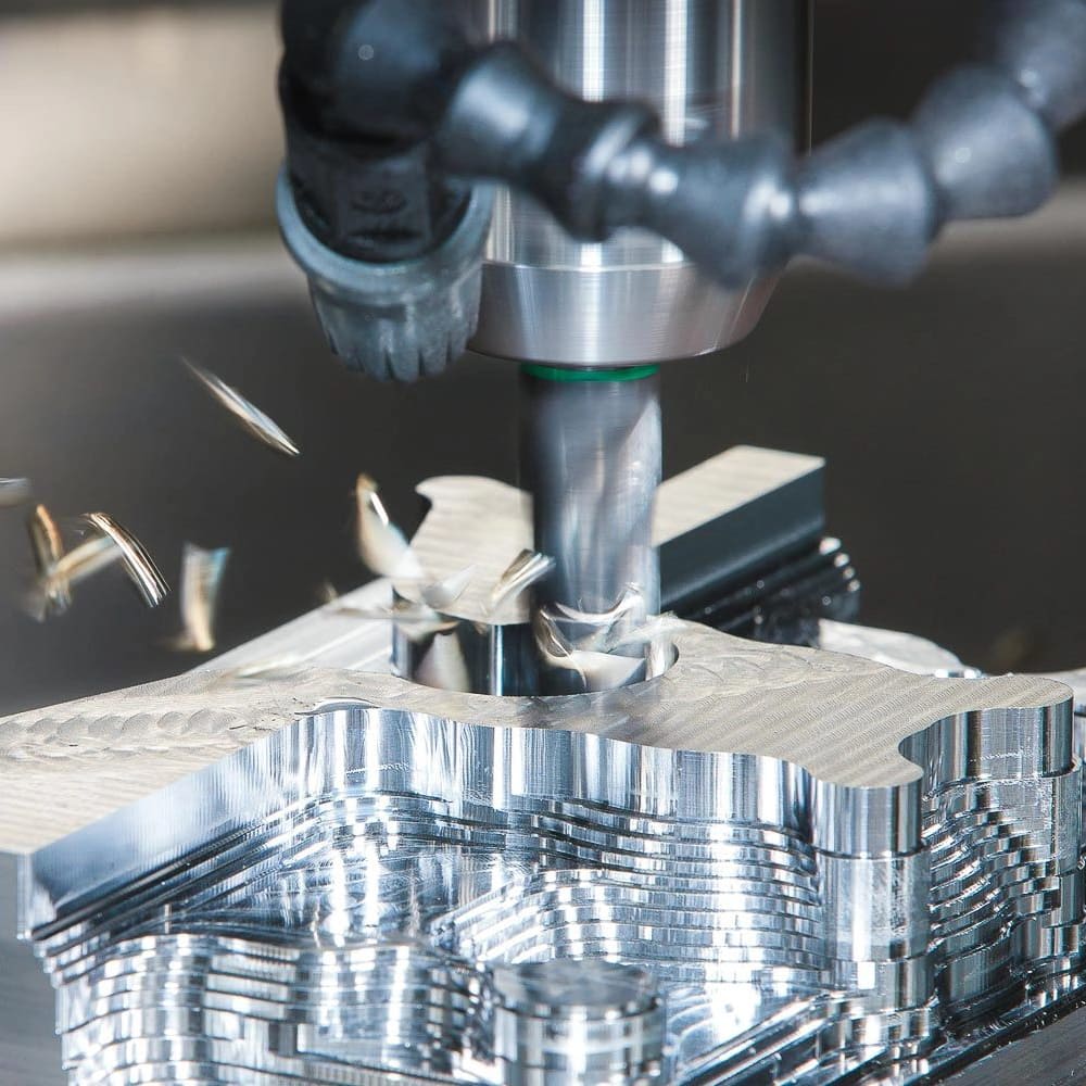 A CNC machine milling a metal part