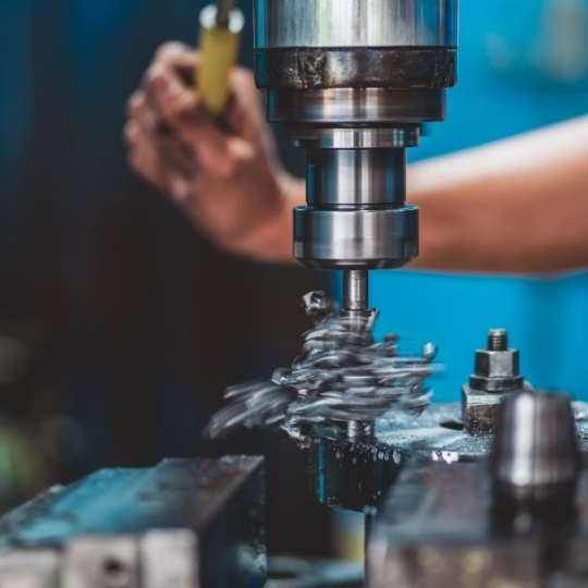 Brass parts being machined on a lathe
