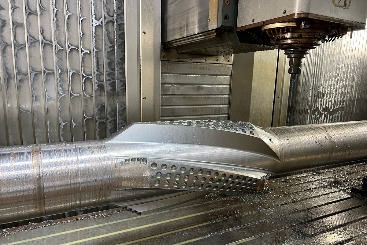 Brass parts being machined on a lathe