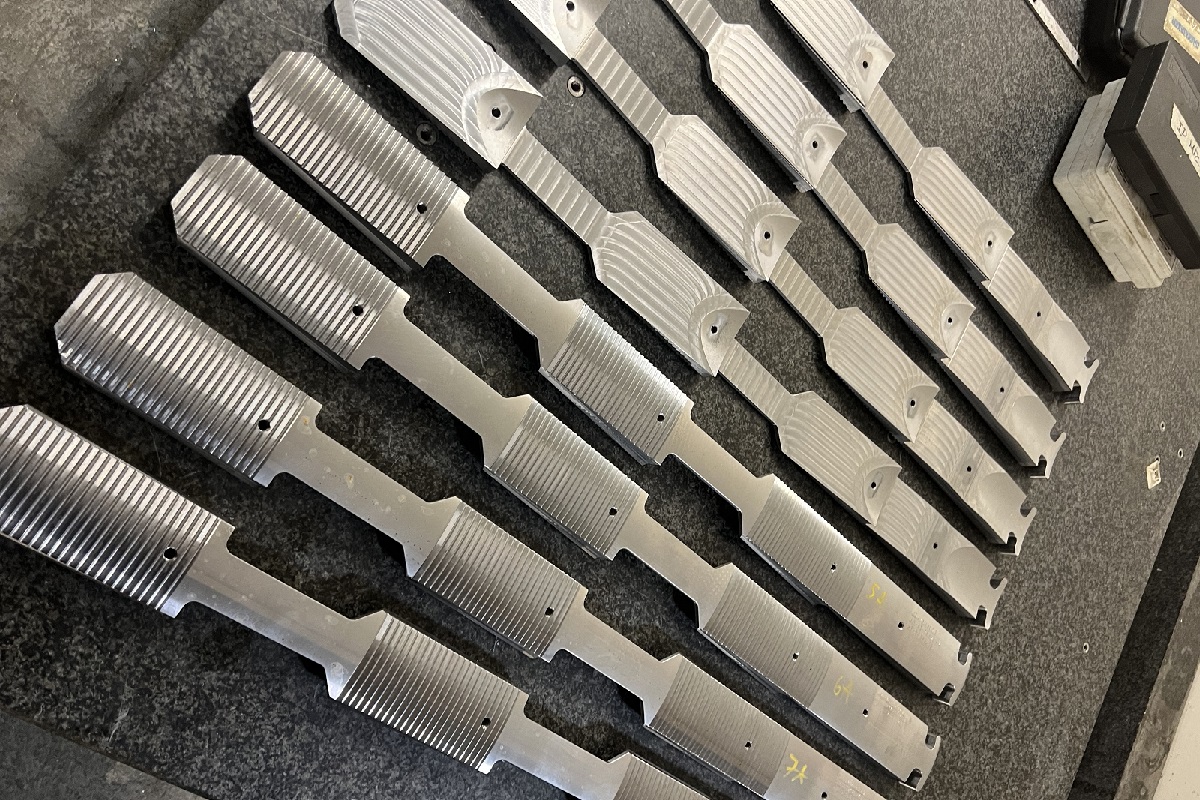 Brass parts being machined on a lathe