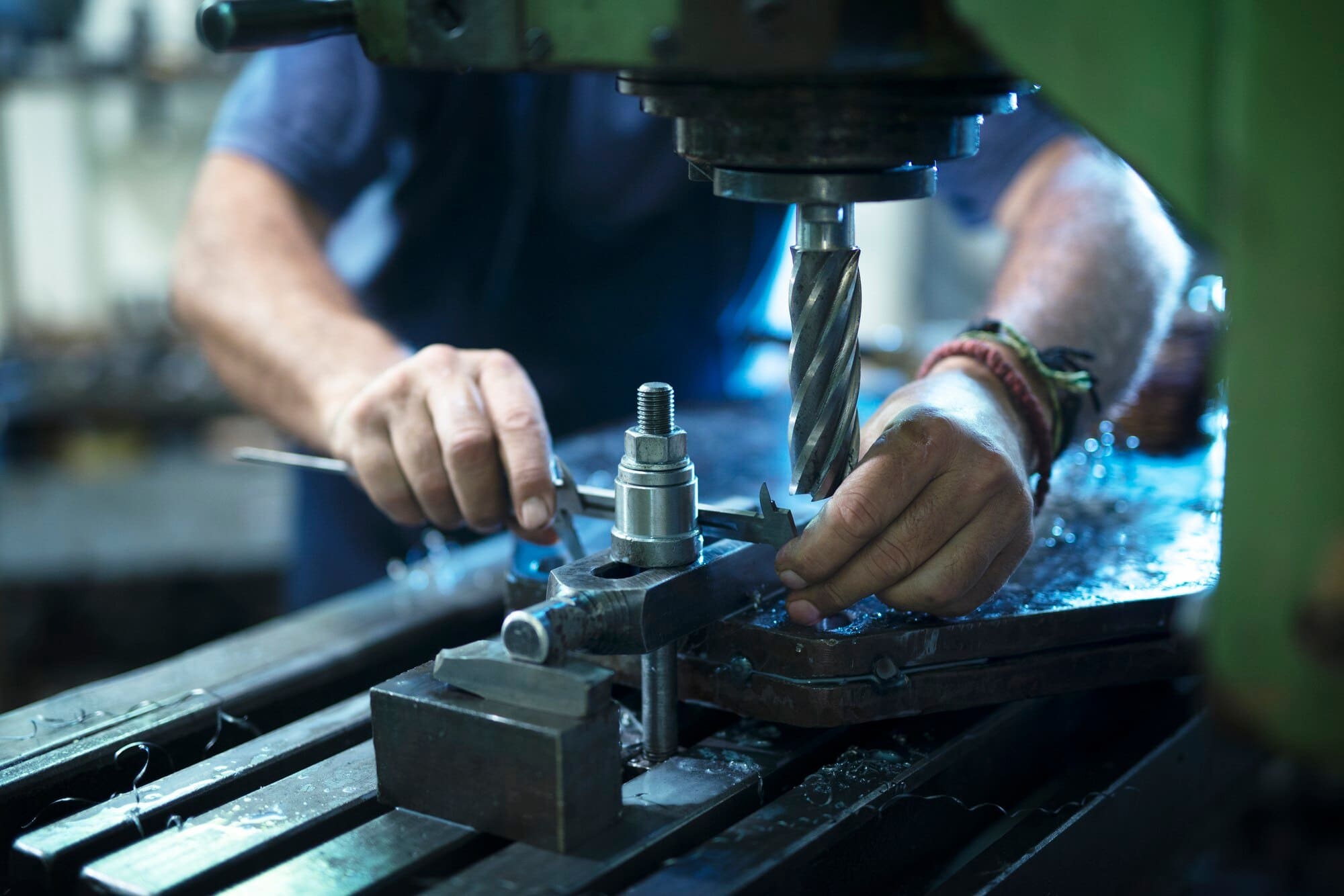 Metal being pressed in a machine