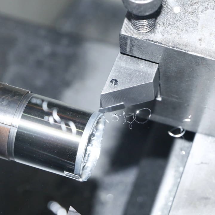 A CNC machine milling a metal part